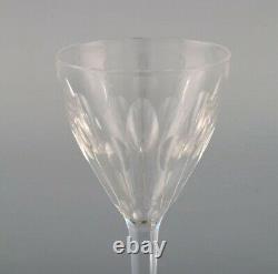 Baccarat, France. Seven white wine glasses in clear mouth-blown crystal glass