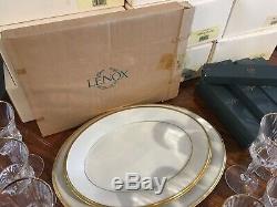 Lenox Eternal China set with platters, flatware, and crystal wine glasses